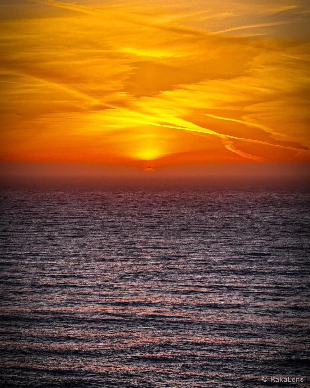 Sunset’s sigh, painting the sky, a masterpiece before the night.
