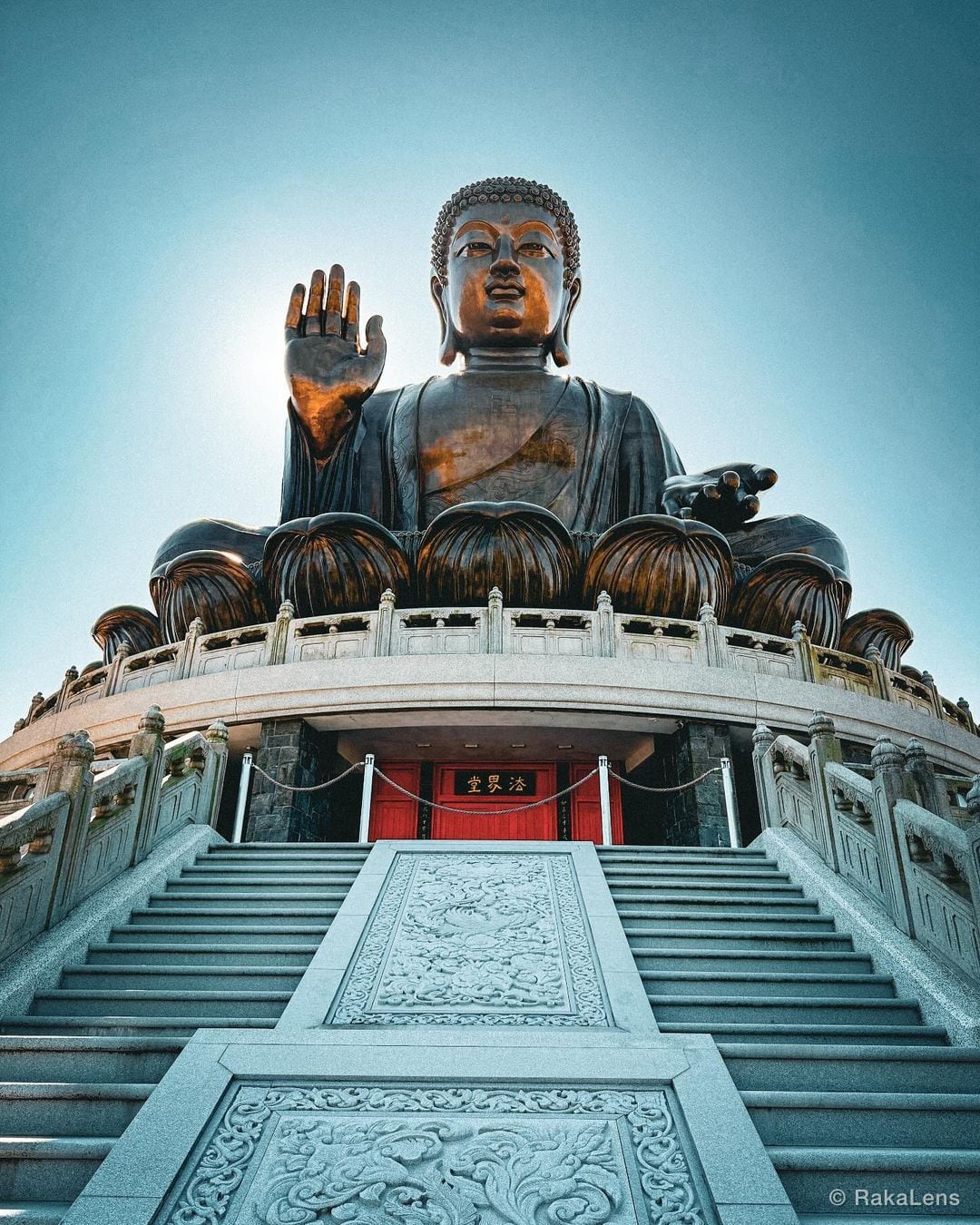 Calm above the clouds, the Tian Tan Buddha watches over with timeless grace. A…
